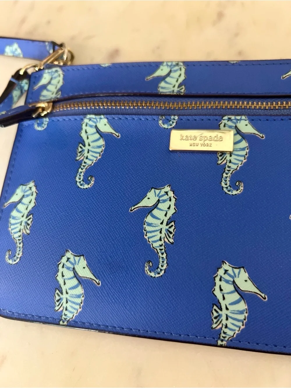 kate spade cobalt blue seahorse wristlet clutch